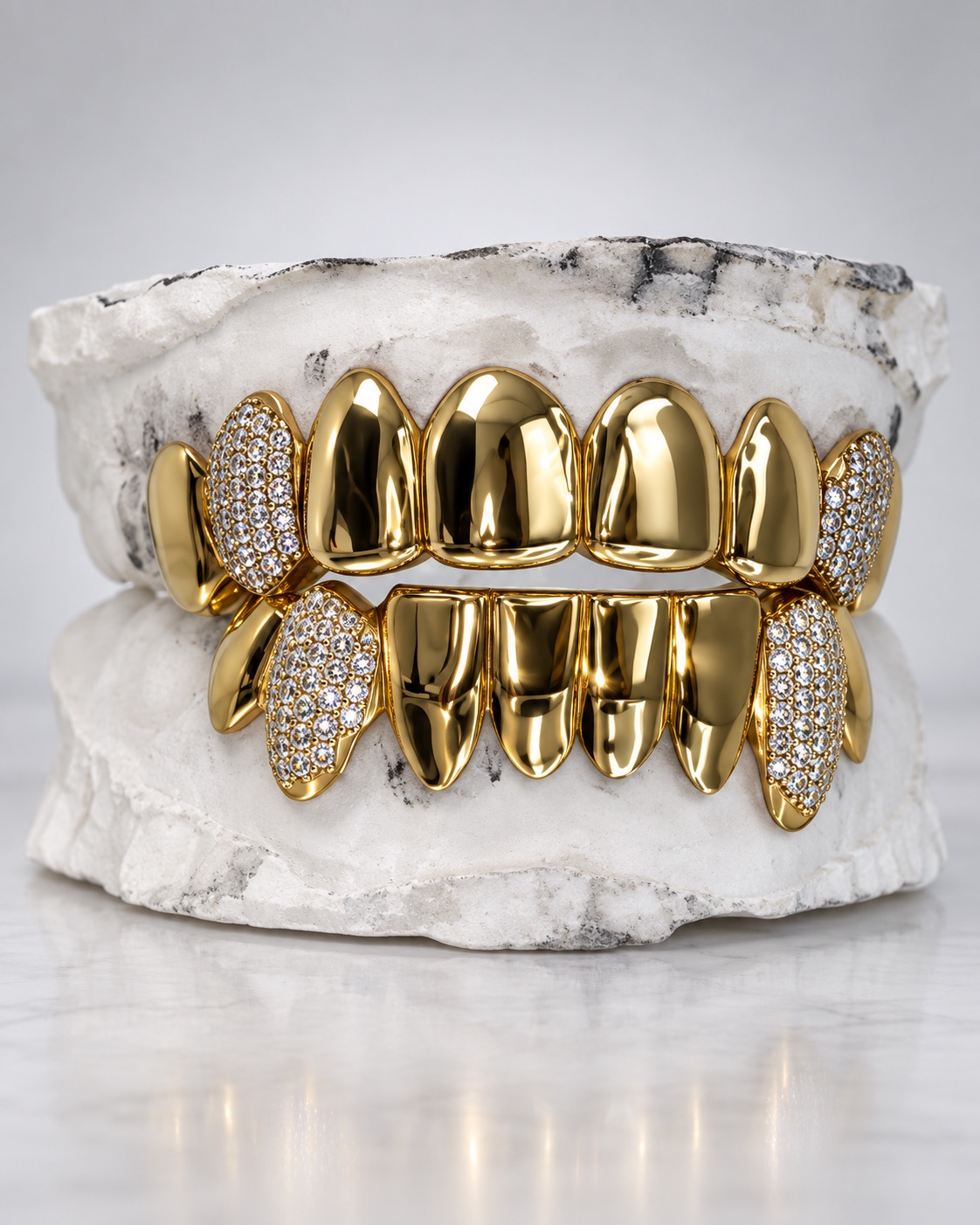 Gold top and bottom custom grillz with iced K9 accents made by YZ Jewelers