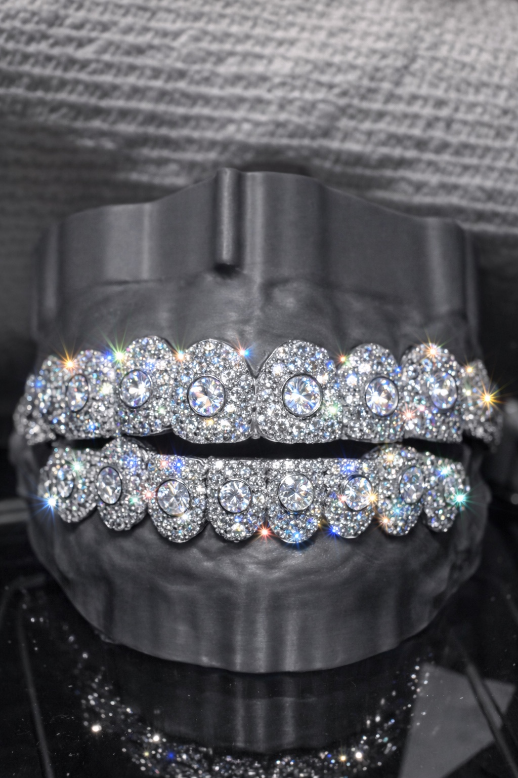 Fully iced top and bottom grillz with large round center stones made by YZ Jewelers